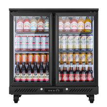 Three-door commercial bar cooler fully stocked with bottled drinks, canned beverages, and soft drinks behind glass doors