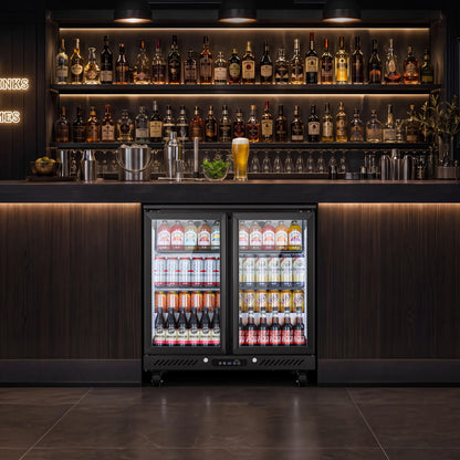 Three-door beverage refrigerator installed beneath a bar counter with illuminated liquor display above