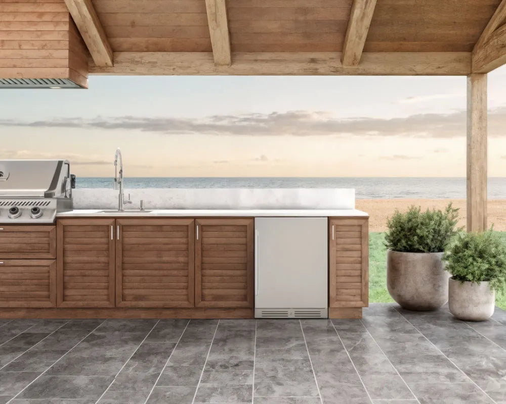 Yeego 24-inch outdoor beverage fridge built into an outdoor kitchen